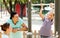 Parents with teenager training on pull-up bar