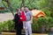 Parents with their daughter in the playground in garden