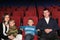 Parents with their two sons in cinema