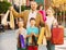 Parents with two teenagers going for shopping outdoors