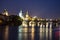 Pargue charles bridge by night reflections river moving lights