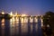 Pargue charles bridge by night reflections river moving lights