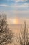 A parhelion (plural parhelia, sundog) - atmospheric optical phenomenon that consists of a bright colored spot in the sky