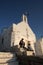 Parikia, Greece, September 16 2018, Greek children play near the church of Agios Konstantinou, a traditional Cycladic church