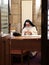 Paris, 6 Parvis Notre-Dame - Pl. Jean-Paul II, Notre Dame Cathedral ,December 20, 2018. Nun sitting at the table