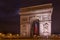 Paris Arc de Triomphe Triumphal Arch at Chaps Elysees at night,