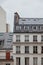 Paris, beautiful buildings in the center, typical parisian roofs