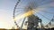 Paris cityscape lit by golden sunshine, viewing sights from observation wheel