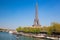 Paris with Eiffel Tower against boats during spring time in France