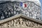 Paris - The facade of Pantheon against the background of repaired dome