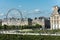 The Paris Ferris Wheel  on the Place de la Concorde Louvre Museum at the right bank of Seine Rive, the world`s largest art museum