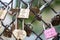 Paris, France, 11.22.2018 Montmartre, Fence with memorable locks with the image of the Eiffel Tower near Sacre Coeur Basilica