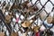 Paris, France, 11.22.2018 Montmartre, Fence with memorable locks with the image of the Eiffel Tower near Sacre Coeur Basilica