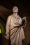 Paris, France - 24.04.2019: Voltaire`s tomb and statue in the crypt of the Pantheon in Paris, France