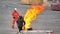 Paris, France - April 2019: Stuntman at motor show exhibits in the flames