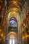 PARIS, FRANCE - August 16, 2018 - interior of the Notre Dame cathedral with suggestive arches and illuminated vaults and gothic