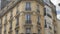 PARIS, FRANCE- August 2018: Vertical panorama of a typical french corner house. Slow Motion