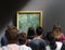 Paris, France - August 29, 2019: Crowd of visitors near the Water-Lily Pond, Symphony in Green 1899 by Claude Monet painting in