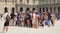 PARIS, FRANCE- CIRCA August 2017: Group of people in Louvre museum yard. Tourists on excursion