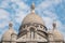 Paris, France - close-up of cupolas and central dome of Sacre-Coeur minor basilica. Sacred Heart church up Montmartre hill.