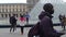 PARIS, FRANCE - DECEMBER, 31, 2016. Multiethnic tourists posing and making photos near the Louvre, famous French museum