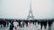 PARIS, FRANCE - DECEMBER, 31. Multinatonal tourists taking photos and making selfie near Eiffel Tower, the most famous