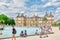 PARIS, FRANCE - JULY 08, 2016 : Children float boats in the fou