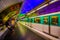 Paris, France - June 1, 2015: Metropolitain subway metro station, train rapidly passing by platform with cool neon