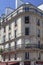 PARIS, FRANCE - June 14, 2022: Parisian residential buildings. Architecture of old Paris, beautiful facade, typical french houses