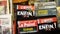 Paris, France - June, 2019: Magazine covers and newspapers on stall. Action. Close-up of bright magazine headlines with