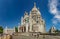 PARIS, FRANCE - JUNE 23, 2016: Basilica of the Sacred Heart of Jesus stands at the summit of the butte  Montmartre - highest point