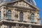 PARIS, FRANCE - JUNE 23, 2017: Gable of the Pavillon Richelieu of the Louvre. Is the world largest art museum and is housed in the