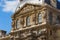 PARIS, FRANCE - JUNE 23, 2017:  Gable of the Pavillon Richelieu of the Louvre. Is the world largest art museum and is housed in