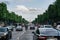 PARIS, FRANCE - JUNE 25, 2016: View of Champs-Elysees in dusk - the most famous avenue of Paris has 1910m and is full of stores,