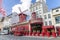 Paris, France - March 16, 2018: Moulin Rouge - famous cabaret built in 1889, in red-light district Pigalle on Boulevard de Clichy