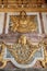 Paris, France, March 28 2017: Golden ceiling Royal Chateau at the Palace of Versailles near Paris