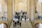 Paris, France - March 31, 2019: People on stairs look at The Winged Victory of Samothrace.