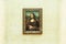 PARIS, FRANCE - MAY 01, 2018: Mona Lisa, La Joconde Leonardo da Vinci in white wall background in Louvre.