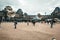 PARIS, FRANCE - MAY 09, 2019: View of glass Pyramid and Louvre Museum through multi-colored soap bubbles of street entertaining,