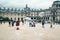 PARIS, FRANCE - MAY 09, 2019: View of glass Pyramid and Louvre Museum through multi-colored soap bubbles of street entertaining,