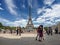 Paris, France, May 2021. Dancing Argentine couples tango on the Tracadero square in the background the Eiffel Tower symbol of