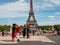 Paris, France, May 2021. Dancing Argentine couples tango on the Tracadero square in the background the Eiffel Tower symbol of