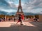 Paris, France, May 2021. Dancing Argentine couples tango on the Tracadero square in the background the Eiffel Tower symbol of