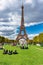 Paris, France - September 17, 2022: People resting on the grass of Park Champ de Mars at the Eiffel Tower in Paris. France