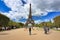 Paris, France - September 17, 2022: People on the walk at Park Champ de Mars by the Eiffel Tower in Paris. France