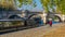 Paris, France - Timelapse - Fall Colors on the Docks of Paris Tourists Cruises on Seine River Historic Bridge