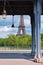 Paris, historical metal bridge Pont de Bir- Hakeim over Seine river with partial view of Eiffel tower