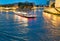 PARIS - JULY 2014: Bateau Mouche at night along the Seine River with tourists. This is a famous tourist attraction