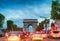 PARIS - JULY 7, 2014: Traffic along Triumph Arc at sunset. Traffic is a major issue for the french capital