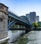 Paris new modern building district and ile aux Cygnes railway bridge